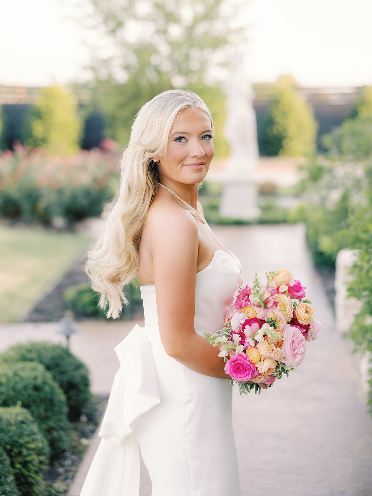 bride with pink peach orange bouquet